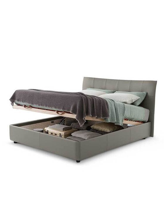 Aurora Duo bed by Poltrona Frau in Pelle Frau® leather with capitonné headboard, trapezoidal wooden base, and optional storage unit. Luxurious Italian craftsmanship. by Poltrona Frau for sale at Home Resource Modern Furniture Store Sarasota Florida