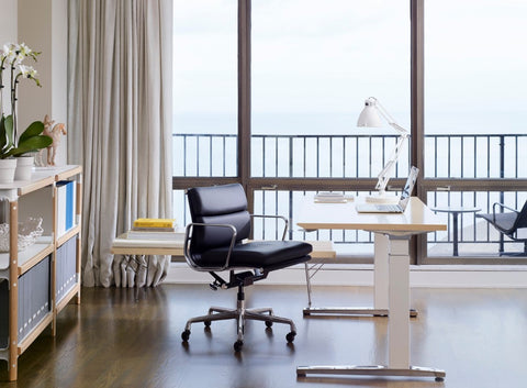 Renew Sit-to-Stand Table by Herman Miller, promoting ergonomic movement with a modern design. Available at Home Resource of Sarasota Florida.