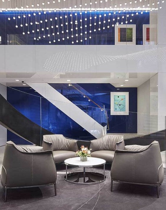 Poltrona Frau Archibald Armchair in fine leather with high backrest, contrast stitching, and cast aluminum base. A luxurious and elegant living room chair.
 by Poltrona Frau for sale at Home Resource Modern Furniture Store Sarasota Florida