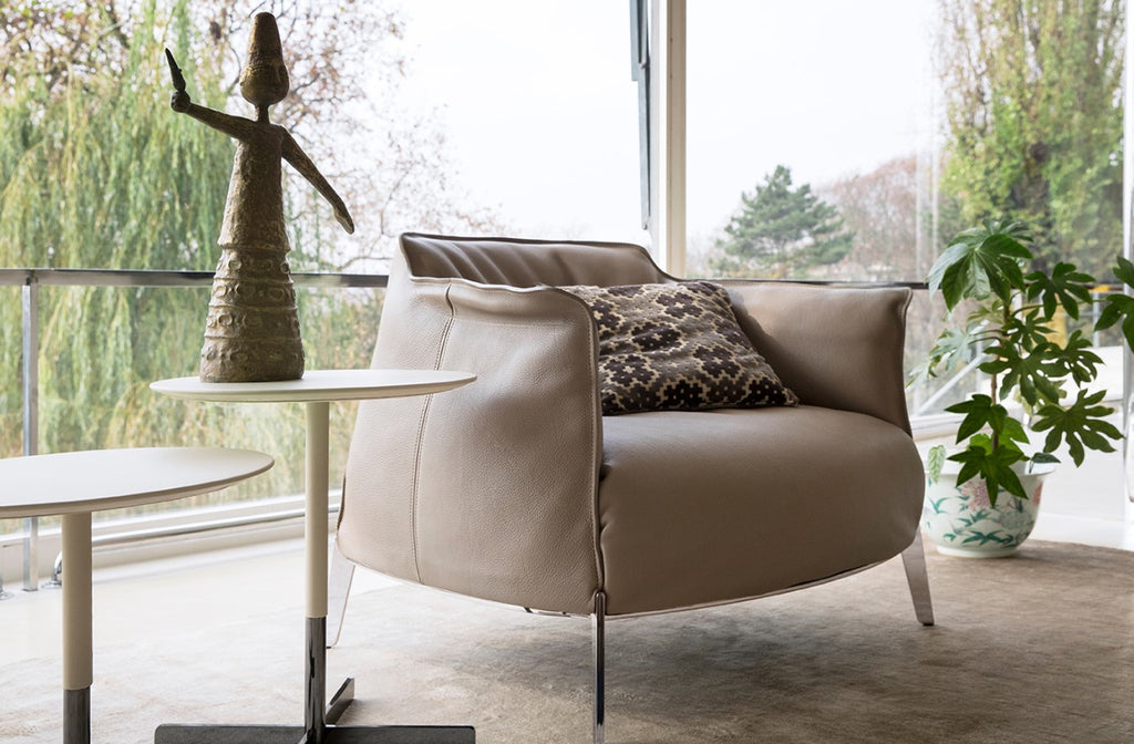 Poltrona Frau Archibald Gran Comfort chair, featuring soft leather upholstery and goose-down padding, with an architectural steel frame and ruthenium finish, for luxurious comfort.
 by Poltrona Frau for sale at Home Resource Modern Furniture Store Sarasota Florida