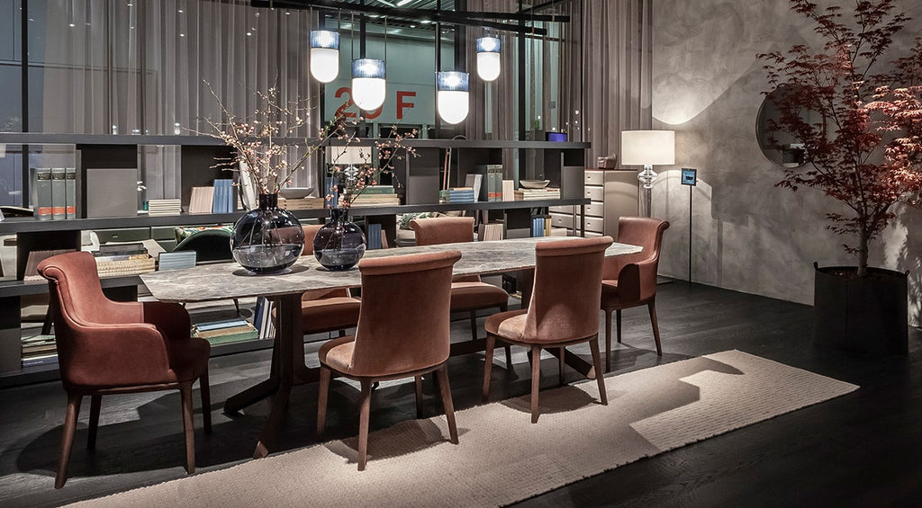 Poltrona Frau Diva dining room chair in fine leather with an elegant curved backrest, handcrafted with luxurious craftsmanship and sophisticated Italian design.
 by Poltrona Frau for sale at Home Resource Modern Furniture Store Sarasota Florida