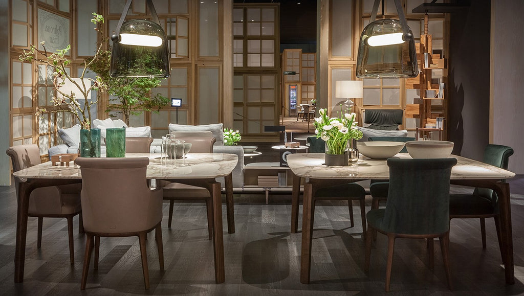 Poltrona Frau Diva dining room chair in fine leather with an elegant curved backrest, handcrafted with luxurious craftsmanship and sophisticated Italian design.
 by Poltrona Frau for sale at Home Resource Modern Furniture Store Sarasota Florida