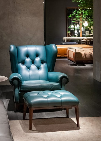 Glenn Ottoman by Poltrona Frau, featuring solid ash base, birch plywood frame with Wenge or Moka stain, four slender legs, Pelle Frau® leather upholstery, and elastic belt spring system. by Poltrona Frau