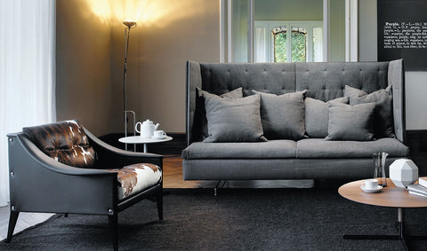 GranTorino HB sofa by Poltrona Frau, featuring compact volume, titanium-colored aluminum feet, birch plywood panels, goose down cushions, and luxurious Pelle Frau® leather upholstery. by Poltrona Frau