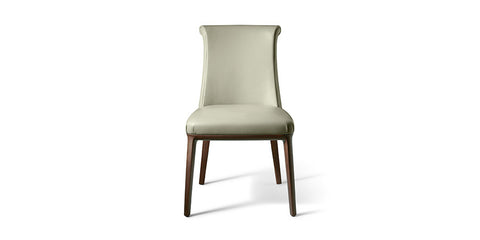 Poltrona Frau Diva dining room chair in fine leather with an elegant curved backrest, handcrafted with luxurious craftsmanship and sophisticated Italian design.
 by Poltrona Frau