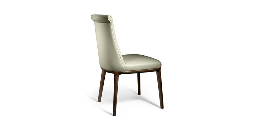 Poltrona Frau Diva dining room chair in fine leather with an elegant curved backrest, handcrafted with luxurious craftsmanship and sophisticated Italian design.
 by Poltrona Frau for sale at Home Resource Modern Furniture Store Sarasota Florida