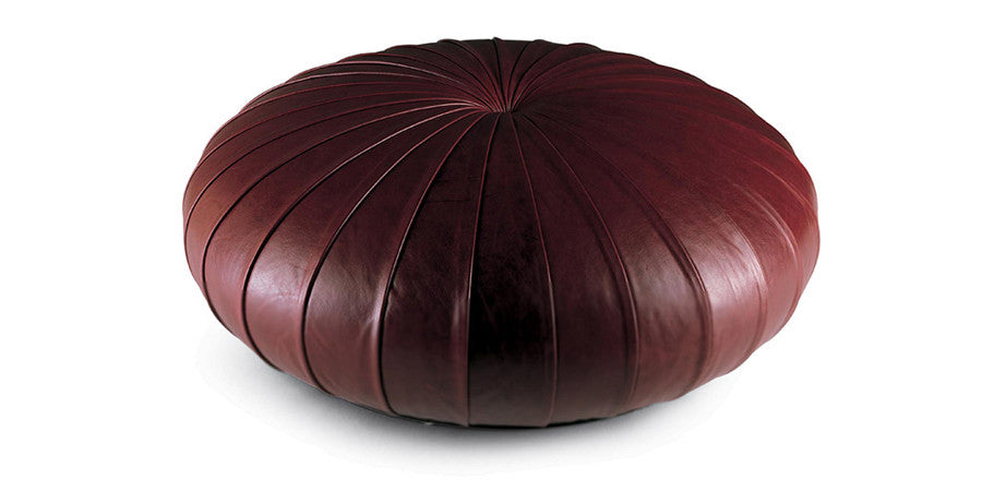 Esedra Ottoman by Poltrona Frau, featuring luxurious Pelle Frau® leather upholstery, Lapp handicrafts-inspired design, and plywood and polyurethane foam padded internal frame.  by Poltrona Frau, available at the Home Resource furniture store Sarasota Florida