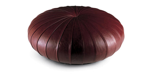 Esedra Ottoman by Poltrona Frau, featuring luxurious Pelle Frau® leather upholstery, Lapp handicrafts-inspired design, and plywood and polyurethane foam padded internal frame. by Poltrona Frau