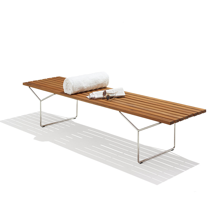 Knoll Bertoia Outdoor Bench featuring teak slats and timeless design, perfect for contemporary patios and outdoor living areas.  by Knoll, available at the Home Resource furniture store Sarasota Florida