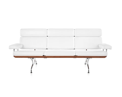 Eames Sofa by Herman Miller, modern and ergonomic, crafted with walnut, leather, and polished aluminum. Available at Home Resource Sarasota.