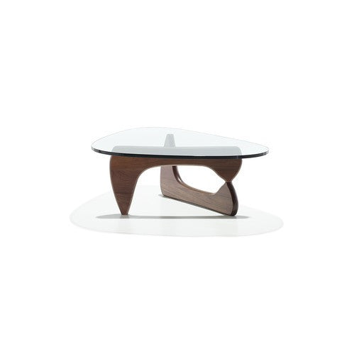 A modern and contemporary Noguchi Table by Herman Miller, featuring a sculptural wood base and freeform glass top, perfect for dining rooms or offices. Iconic design available at Home Resource of Sarasota Florida.  by Herman Miller, available at the Home Resource furniture store Sarasota Florida