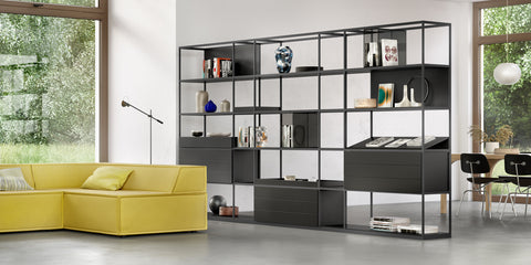 Modular Interlübke Tado Shelving System, showcasing customizable options in matte lacquers, glass, and natural materials for a sophisticated living room display.
 by INTERLUBKE