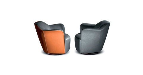 Poltrona Frau Aida Swivel Chair in fine leather, showcasing a luxurious, handmade design with curved armrests, perfect for a sophisticated living room setting.
 by Poltrona Frau