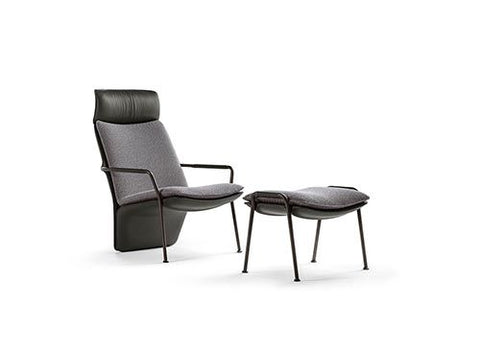 Poltrona Frau Arabesque armchair in fine leather, featuring sinuous lines and elegant design inspired by ballet. Luxurious Italian craftsmanship for sophisticated living spaces.
 by Poltrona Frau