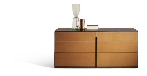 Fidelio Notte chest of drawers, tall boy, or bedside table by Poltrona Frau, featuring Canaletto walnut and birch plywood structure, Cuoio Saddle or Saddle Extra leather upholstery, steel adjustable feet. by Poltrona Frau