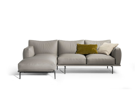 Happy Jack Sofa by Poltrona Frau, featuring soft, rounded cushions, armrests for support, curved design, modular configurations, and Pelle Frau® leather upholstery. by Poltrona Frau