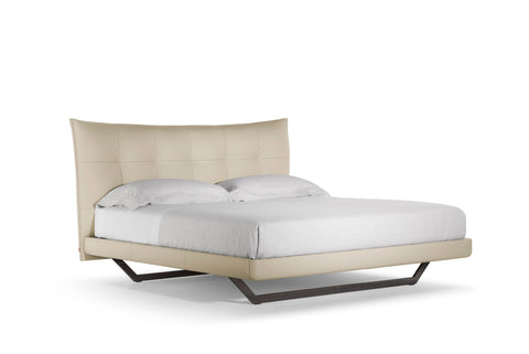 Aurora Tre Bed by Poltrona Frau, upholstered in fine Pelle Frau® leather with a padded, quilted headboard. Luxurious craftsmanship and modern Italian design.
 by Poltrona Frau