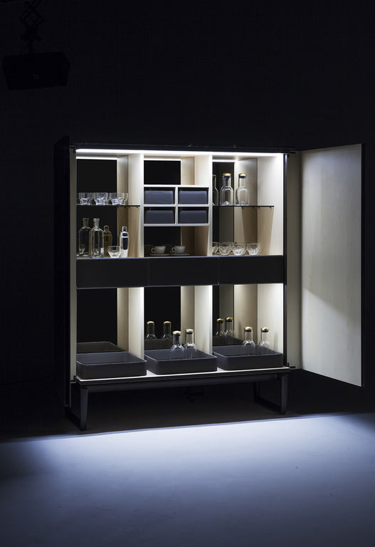 Fidelio Drink Cabinet by Poltrona Frau, featuring solid ash base, maple wood veneered doors, moka-stained solid ash sawhorse base, and adjustable steel feet with rubber caps. by Poltrona Frau for sale at Home Resource Modern Furniture Store Sarasota Florida