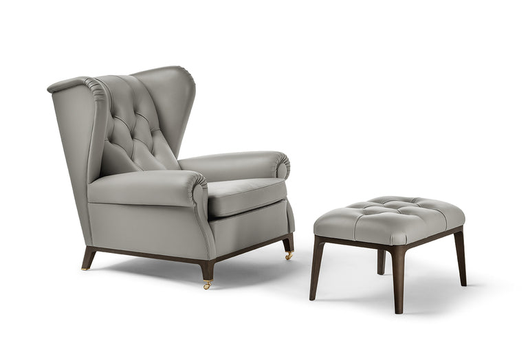 Glenn Ottoman by Poltrona Frau, featuring solid ash base, birch plywood frame with Wenge or Moka stain, four slender legs, Pelle Frau® leather upholstery, and elastic belt spring system. by Poltrona Frau for sale at Home Resource Modern Furniture Store Sarasota Florida