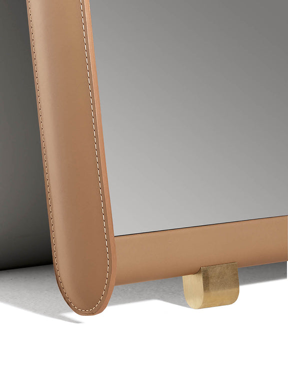 Luxurious Dorian mirror by Poltrona Frau with a padded leather frame, handmade stitching, and sleek modern design for a sophisticated bedroom. Available at Home Resource.
 by Poltrona Frau for sale at Home Resource Modern Furniture Store Sarasota Florida