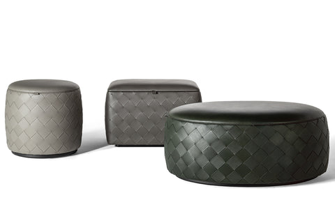 Grant collection of poufs by Poltrona Frau, featuring Pelle Frau® leather upholstery, birch plywood frame, variety of sizes and finishes, decorative belts, and steel buckles. by Poltrona Frau