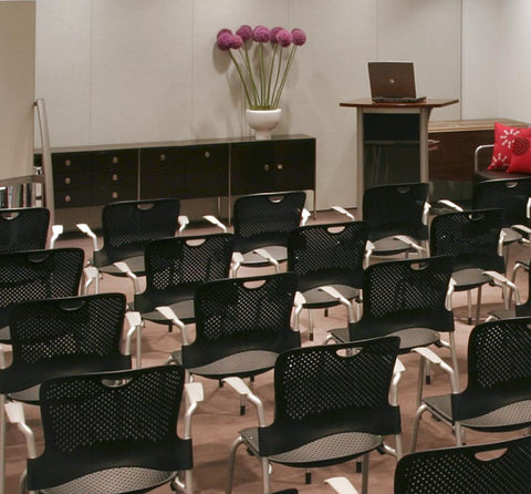 Herman Miller Caper Chair with ergonomic design, vibrant colors, and modern flair, perfect for versatile living room and executive spaces. by Herman Miller