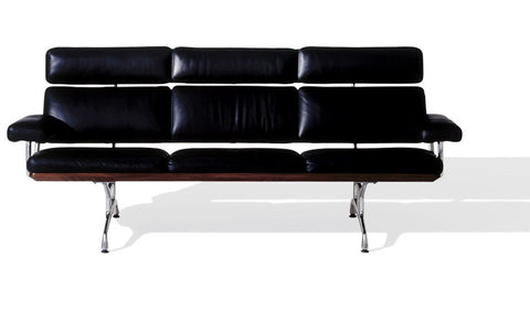 Eames Sofa by Herman Miller, modern and ergonomic, crafted with walnut, leather, and polished aluminum. Available at Home Resource Sarasota.