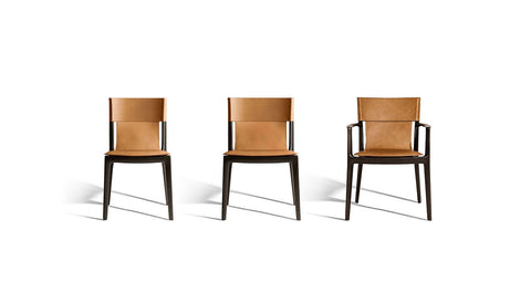 Isadora chair by Poltrona Frau, featuring fine saddle-leather upholstery, solid wood structure, and Italian craftsmanship for an elegant and sophisticated dining room. by Poltrona Frau
