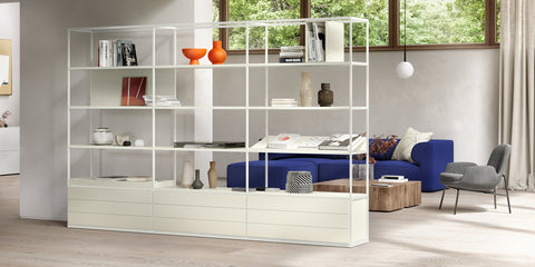 A customizable Interlübke Tado Shelf, featuring modular boxes and handcrafted German design, perfect for displaying personal treasures in a sophisticated living room.
 by INTERLUBKE