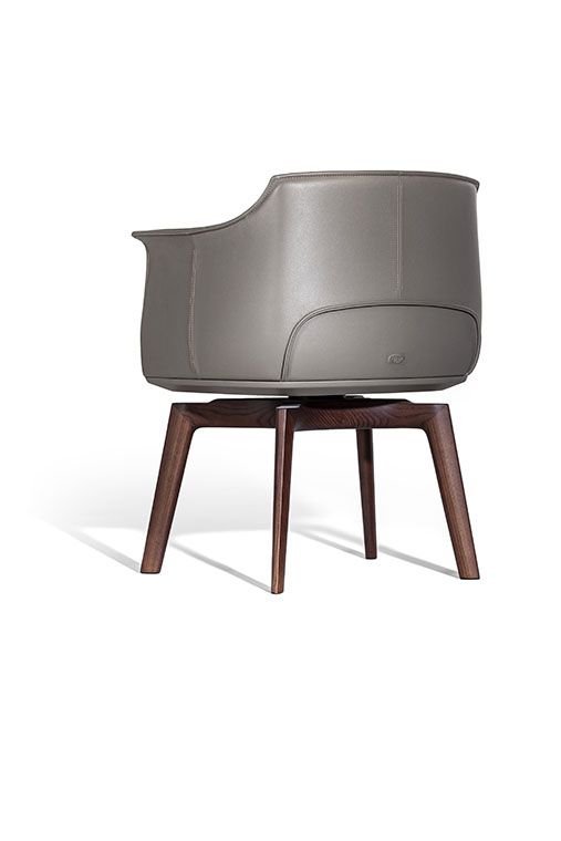 Poltrona Frau Archibald Dining Chair in fine leather, featuring elegant folds on the backrest. Luxurious Italian craftsmanship for a sophisticated dining experience.
 by Poltrona Frau for sale at Home Resource Modern Furniture Store Sarasota Florida