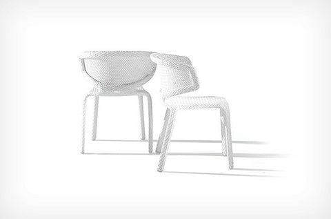 Dedon Seashell Side Chair, a luxury, hand-made, weather-resistant stackable outdoor chair with an open-weave design and modern elegance. by Dedon