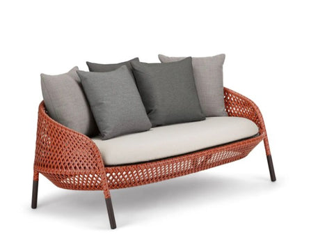 Luxury outdoor AHNDA sofa by Dedon, featuring hand-made weather-resistant materials, ergonomic comfort, and modernist design. by Dedon