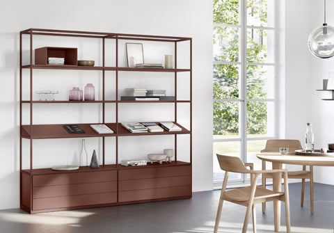 Modular Interlübke Tado Shelving System, showcasing customizable options in matte lacquers, glass, and natural materials for a sophisticated living room display.
 by INTERLUBKE