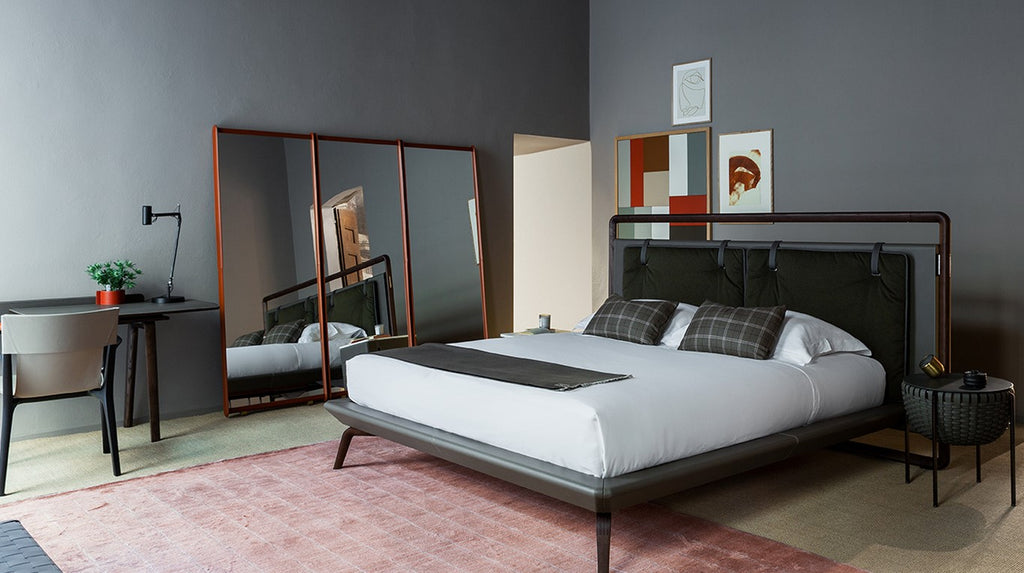 Luxurious Dorian mirror by Poltrona Frau with a padded leather frame, handmade stitching, and sleek modern design for a sophisticated bedroom. Available at Home Resource.
 by Poltrona Frau for sale at Home Resource Modern Furniture Store Sarasota Florida