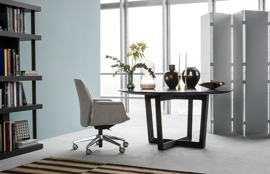 Poltrona Frau Downtown office chair with fine leather upholstery, polished aluminum base, and ergonomic features for luxurious comfort and Italian craftsmanship in an office room setting.
 by Poltrona Frau for sale at Home Resource Modern Furniture Store Sarasota Florida