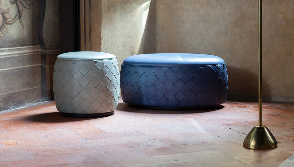 Grant collection of poufs by Poltrona Frau, featuring Pelle Frau® leather upholstery, birch plywood frame, variety of sizes and finishes, decorative belts, and steel buckles. by Poltrona Frau for sale at Home Resource Modern Furniture Store Sarasota Florida