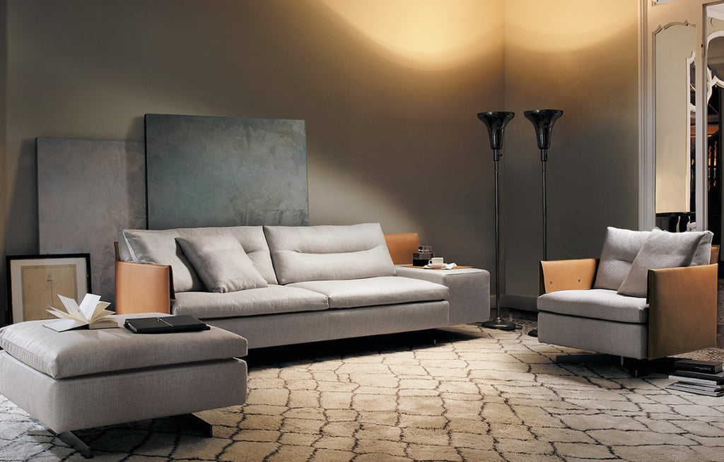 Grantorino Sofa by Poltrona Frau, featuring hand-crafted details, modular design, T-shaped feet, leather and fabric upholstery, hidden trunk-container, and comfortable seats. by Poltrona Frau for sale at Home Resource Modern Furniture Store Sarasota Florida