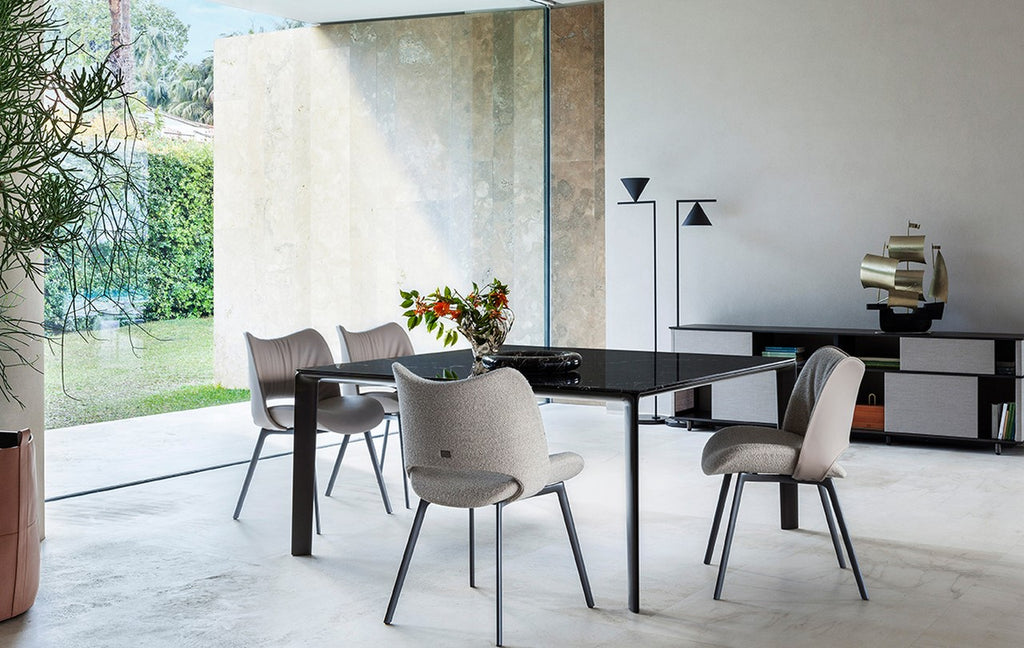 The Homey dining piece by Poltrona Frau, showcasing Italian craftsmanship, fine leather, and modern design, as an elegant and luxurious centerpiece for the dining room. by Poltrona Frau for sale at Home Resource Modern Furniture Store Sarasota Florida