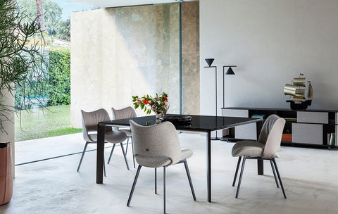 The Homey dining piece by Poltrona Frau, showcasing Italian craftsmanship, fine leather, and modern design, as an elegant and luxurious centerpiece for the dining room. by Poltrona Frau