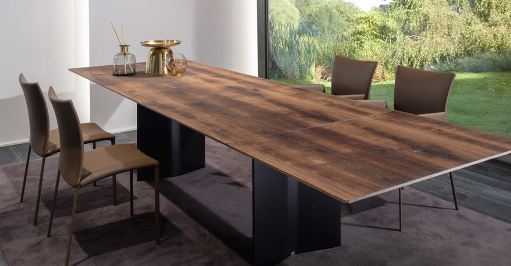 Rectangular dining table by Draenert, featuring a patented swivel plate, available in stone, solid wood, or veneered finishes with a matte brushed aluminum base.
 by DRAENERT for sale at Home Resource Modern Furniture Store Sarasota Florida