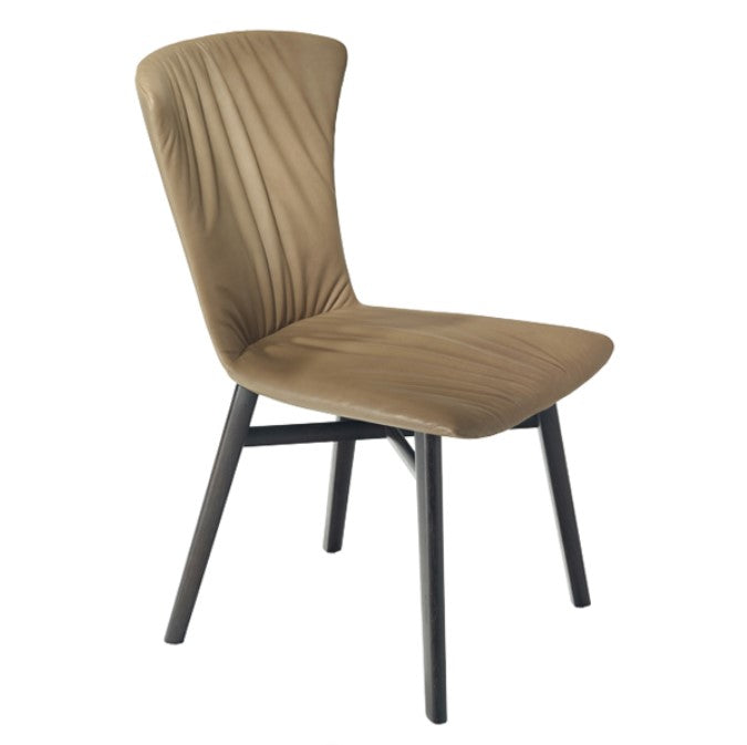 DEXTER dining chair by Draenert, featuring a sweeping contour, ultra-soft leather in 91 colors, and compact design. Available at Home Resource Sarasota. by DRAENERT for sale at Home Resource Modern Furniture Store Sarasota Florida