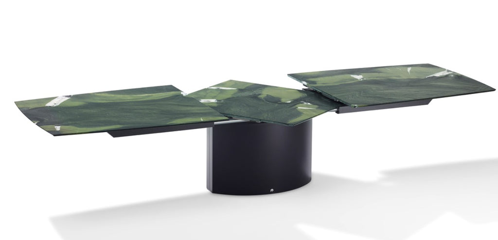 Handcrafted Draenert dining table with a natural stone top, featuring a lifting mechanism for the center plate and various base options. Available at Home Resource Sarasota. by DRAENERT for sale at Home Resource Modern Furniture Store Sarasota Florida