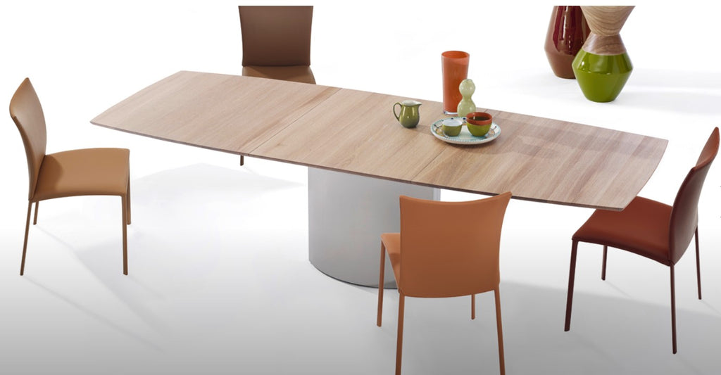 Handcrafted Draenert dining table with a natural stone top, featuring a lifting mechanism for the center plate and various base options. Available at Home Resource Sarasota. by DRAENERT for sale at Home Resource Modern Furniture Store Sarasota Florida