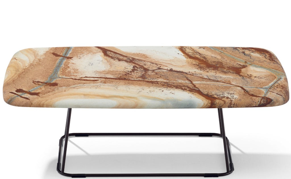 Manolo outdoor table ensemble by Draenert, featuring a natural stone top with a flowing edge and a dark bronze steel base, handcrafted with German design.
 by DRAENERT for sale at Home Resource Modern Furniture Store Sarasota Florida