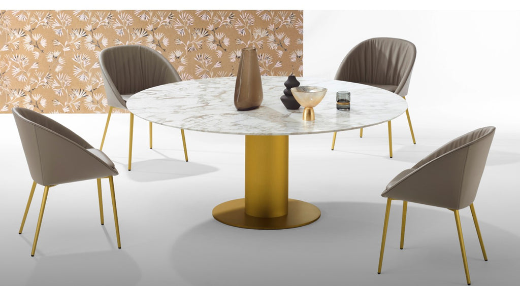 Round dining piece with a natural stone top and steel column base in high-gloss or matte chrome. Optional three-wing stone base. Handcrafted German design by Peter Draenert.
 by DRAENERT for sale at Home Resource Modern Furniture Store Sarasota Florida