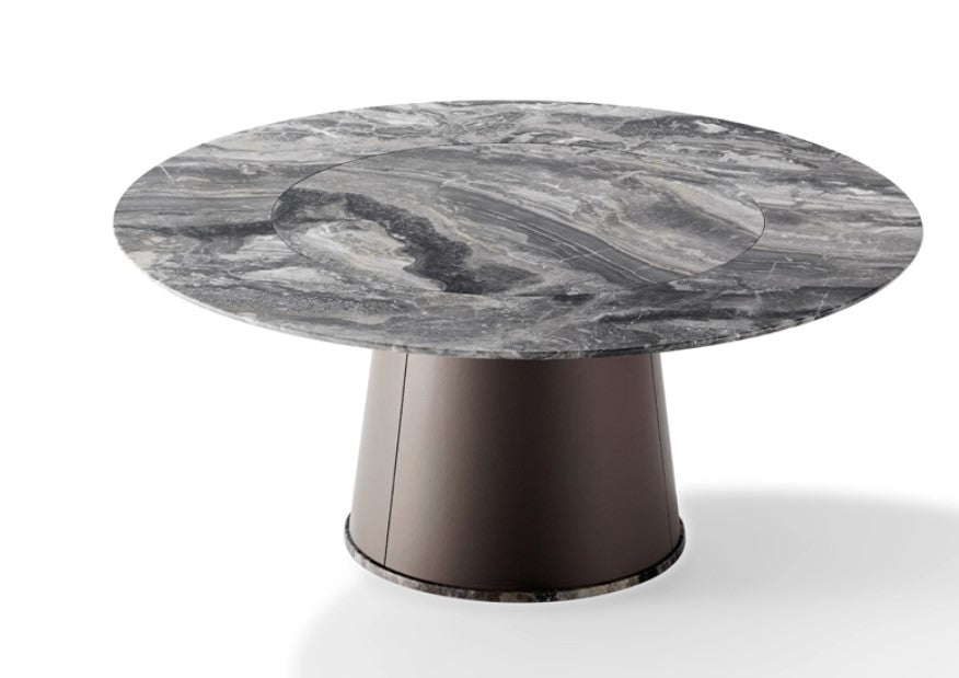 TADAO round dining table by Draenert, featuring a natural stone top with rotating inner plate and a conical base. Handcrafted German design, available in Sarasota.
 by DRAENERT for sale at Home Resource Modern Furniture Store Sarasota Florida