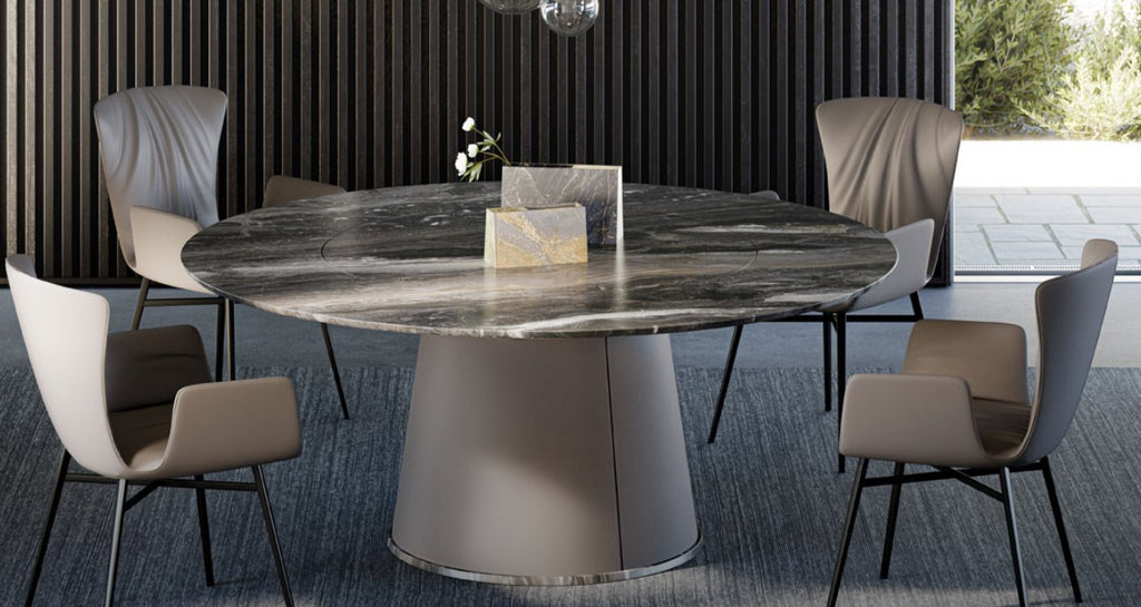 TADAO round dining table by Draenert, featuring a natural stone top with rotating inner plate and a conical base. Handcrafted German design, available in Sarasota.
 by DRAENERT for sale at Home Resource Modern Furniture Store Sarasota Florida