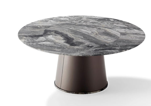 TADAO round dining table by Draenert, featuring a natural stone top with rotating inner plate and a conical base. Handcrafted German design, available in Sarasota.
 by DRAENERT