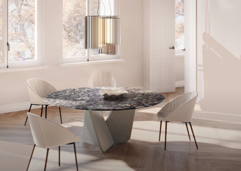 Tadao V round dining table by Draenert with a natural stone base and rotating inner plate, designed by Gino Carollo. Handcrafted and available in Sarasota.
 by DRAENERT