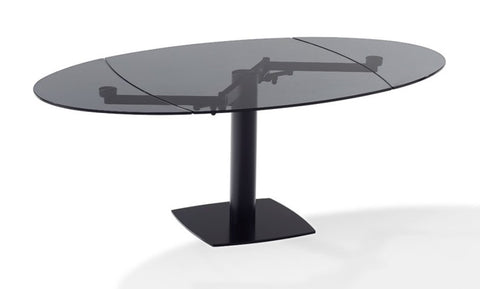 Titan glass dining table by Draenert with two swivel plates, handcrafted German furniture. Modern design with steel substructure. Available at Home Resource of Sarasota.
 by DRAENERT